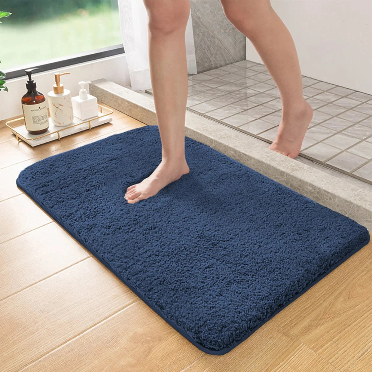 Blue long-pile absorbent bathroom mat with non-slip backing, rectangular