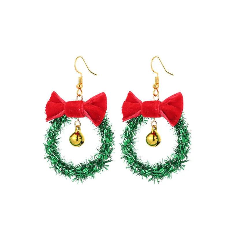 Christmas wreath drop earrings with gold hooks, red bow, and green berry garland charm