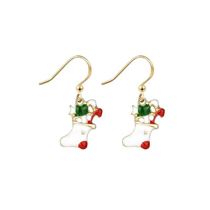 Gold drop earrings with white boot, green bow ornament, red ribbon accent