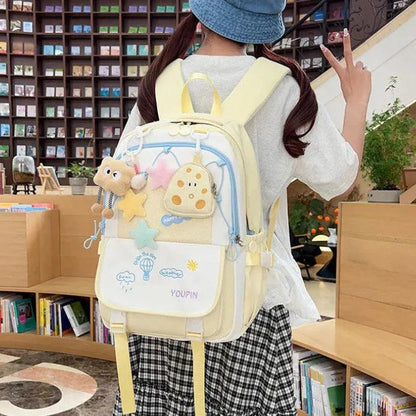 Cream and pale yellow 3-piece backpack set with character details and front flap pockets