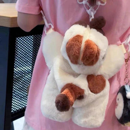 Plush crossbody bag with white cat face, brown ears, heart patch, hanging straps