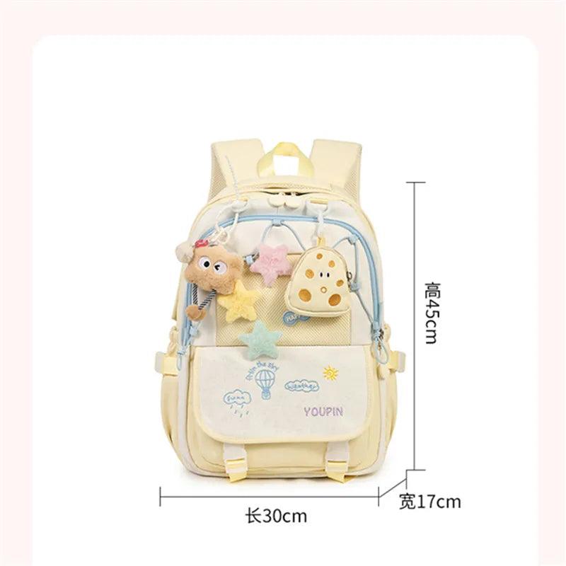 Kids backpack in cream with colorful cloud and hot-air-balloon prints, plush charm