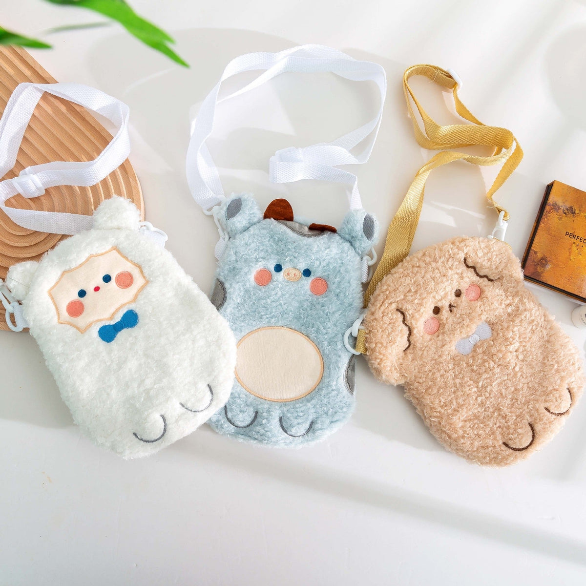 Plush animal crossbody bags set: light blue bear, tan bear, white animal, with straps