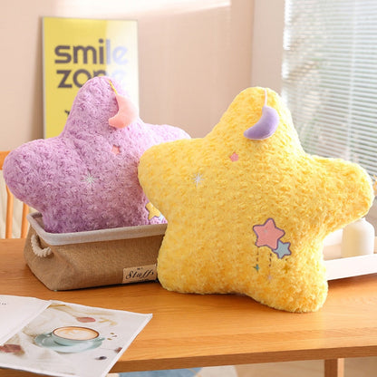 Purple and yellow moon plush pillows with star appliques and crescent cap details