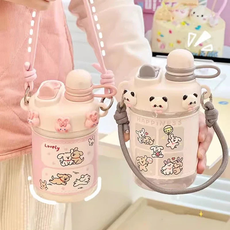 Pink kids water bottle with straw lid and gray carry strap, cute animal cartoon design