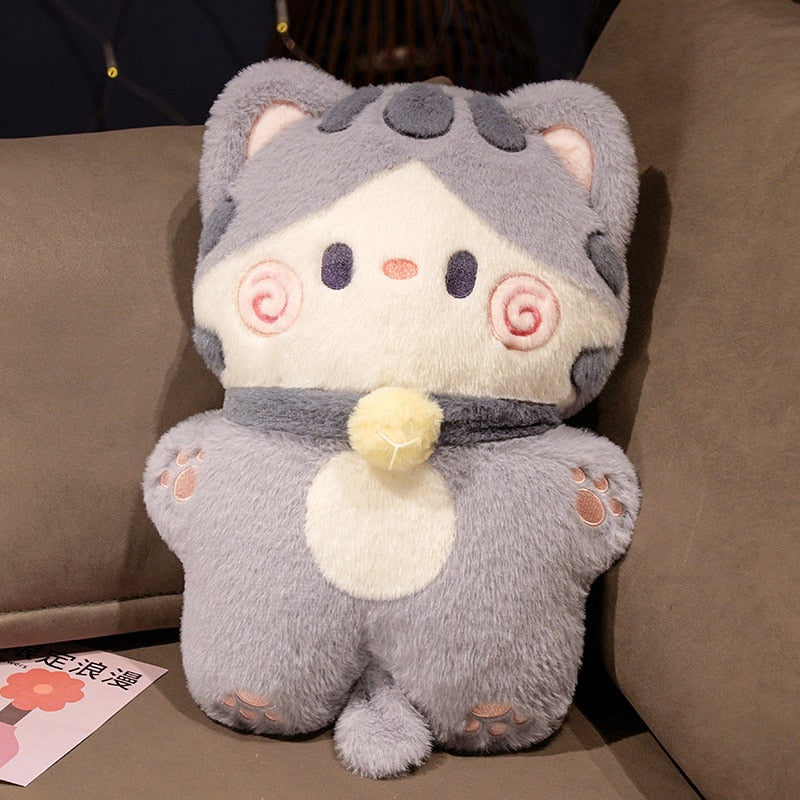 Grey cat-shaped plush pillow with pink swirl cheeks and heart-shaped belly detail