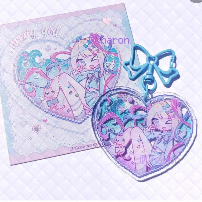 Acrylic heart keychain set with blue bow and two character heart charms