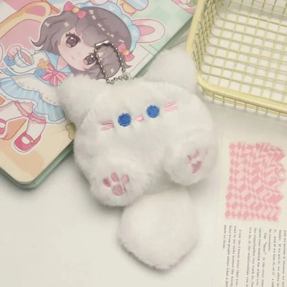 White cat plush keychain with blue eyes and pink paw prints, metal chain