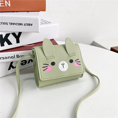 Light green bunny crossbody bag with stitched face and long adjustable strap