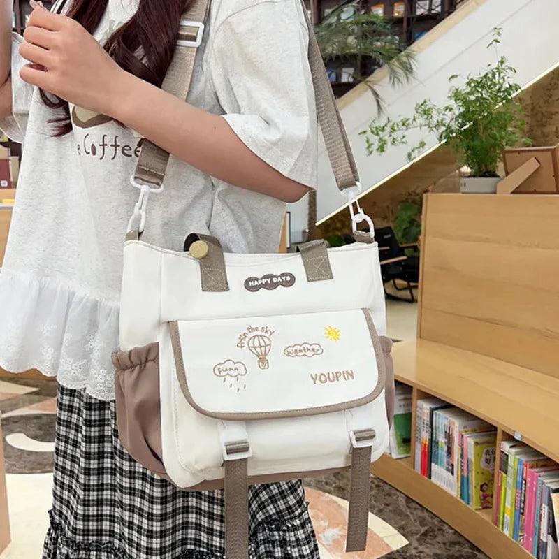 Tan 3-piece backpack set with white front panel and adjustable shoulder straps