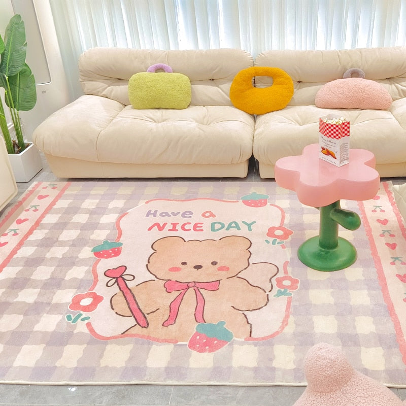Pastel plush area rug with 'Have a NICE DAY' bear motif