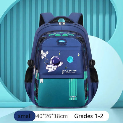 Kids small navy astronaut backpack with teal bottom, astronaut graphic, and front zip pocket