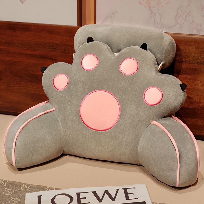 Gray cat-paw reading pillow with pink round face features and stitched paw pads