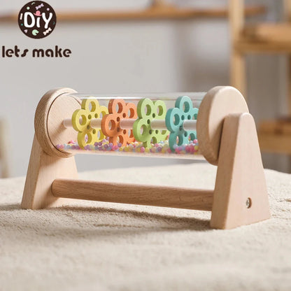Wooden rain stick sensory toy with clear tube and colorful bead inserts in frame