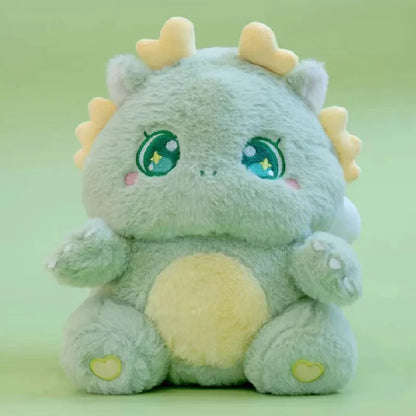 Green baby dragon plush with star-eyed embroidery, yellow horn tips, and heart paws