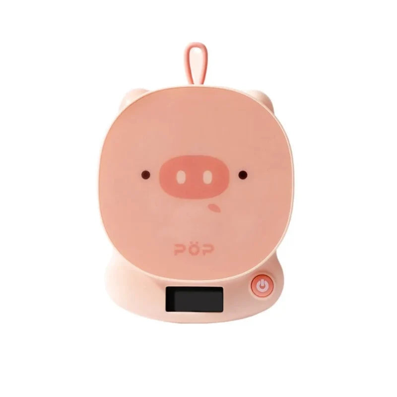 Pink pig-face digital kitchen scale with LCD screen and side power button
