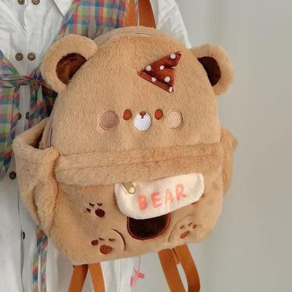 Plush bear backpack with bow, faux-hanging name patch, and small face appliques