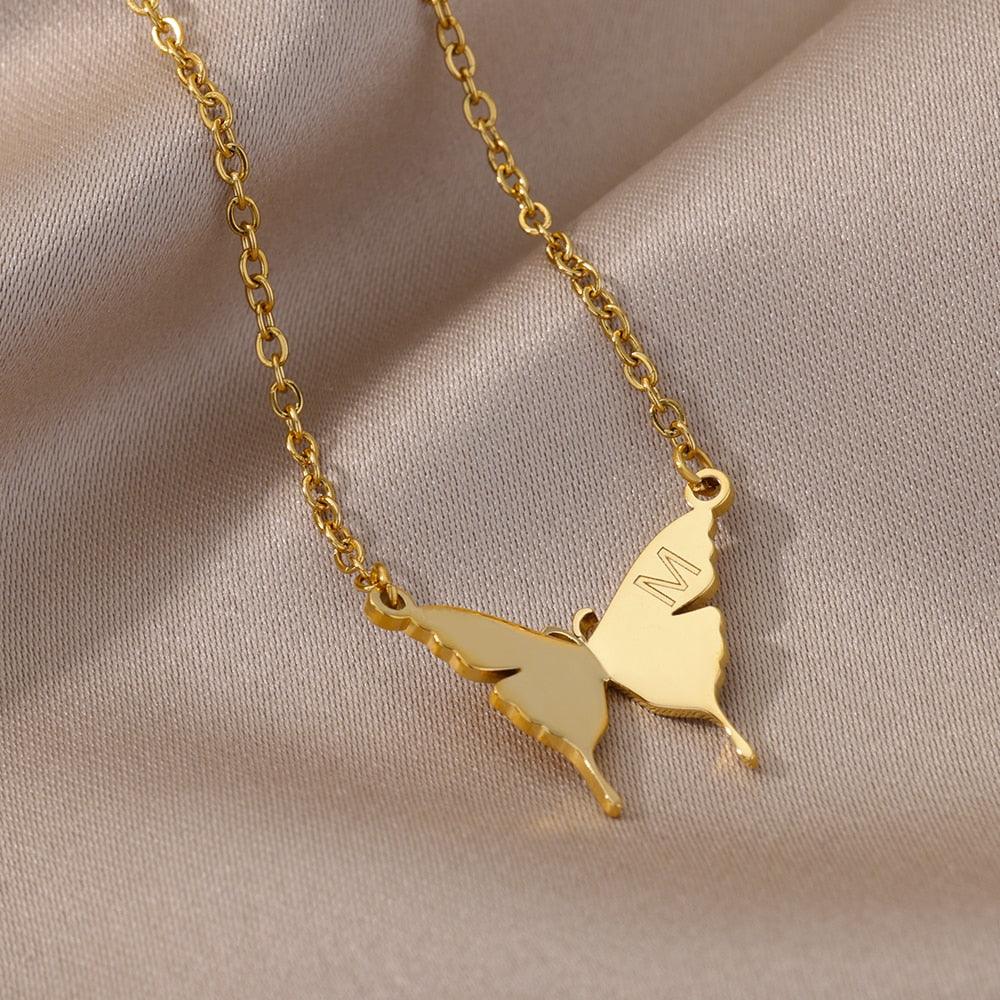 Butterfly pendant necklace with letter M, gold-tone chain