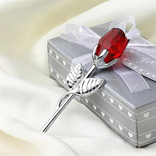 Crystal rose flower figurine with red gem head and silver leaves, tied gift box