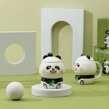 Ceramic panda mug with lid and handle; white mug with black belt and green bamboo accents