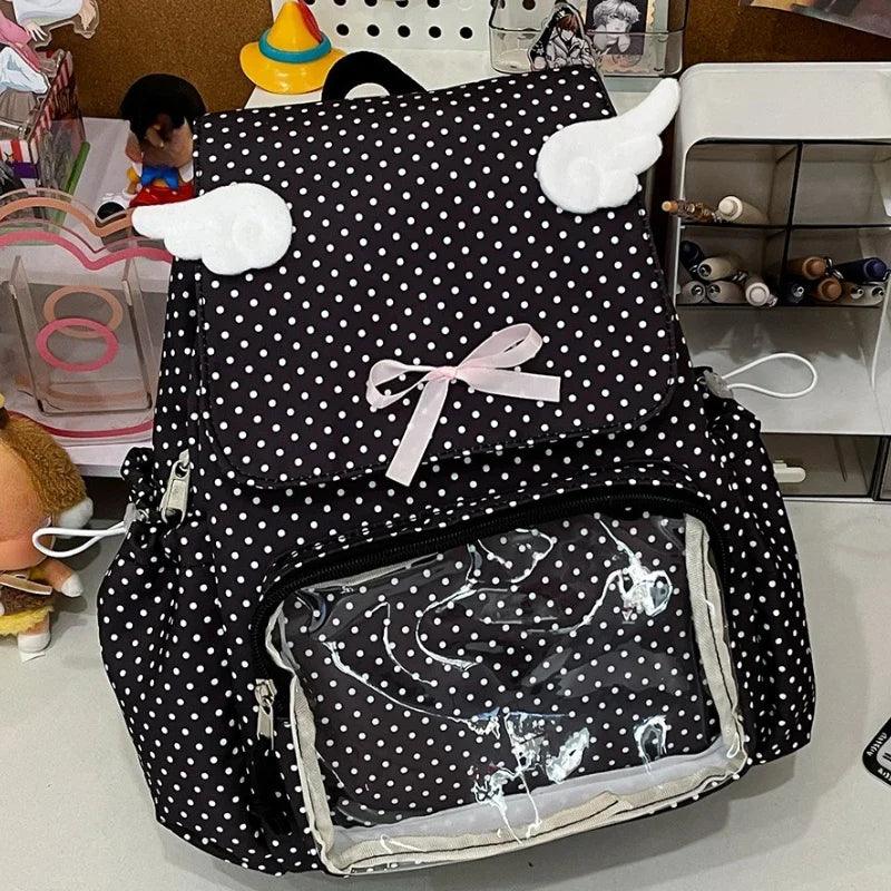 Black polka dot backpack with front bow and clear inner pocket