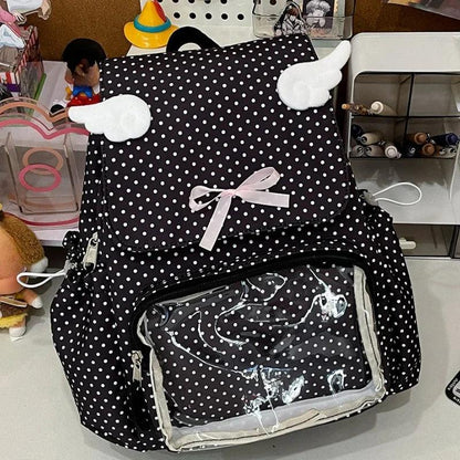 Black polka dot backpack with front bow and clear inner pocket