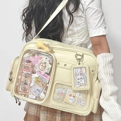 Pastel crossbody bag, light yellow/cream, clear front pouch with charm strap