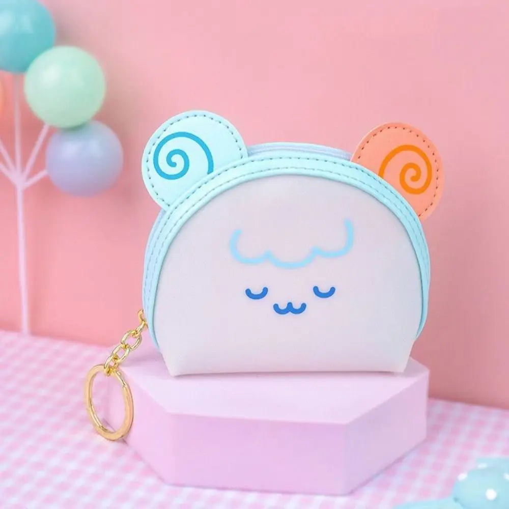 Light blue cat-face coin purse with orange ear accents and gold key ring