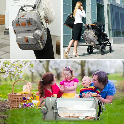 Gray diaper bag backpack with foldable baby bed opened, used with a stroller and outdoors.
