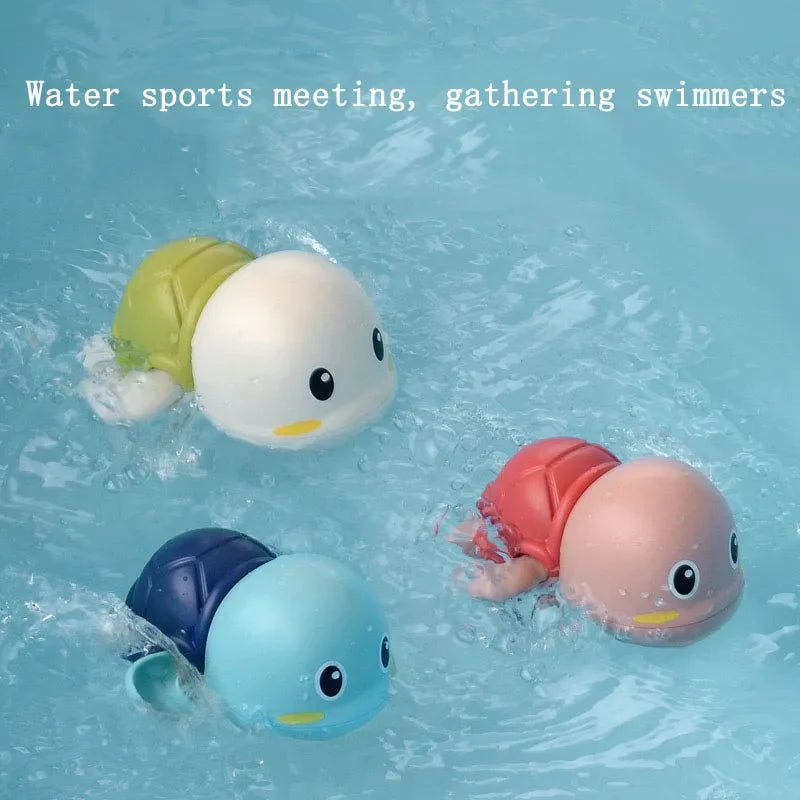 Floating animal bath toys in water with four swimmers: light blue, green, pink, and navy