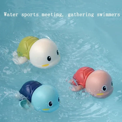 Floating animal bath toys in water with four swimmers: light blue, green, pink, and navy