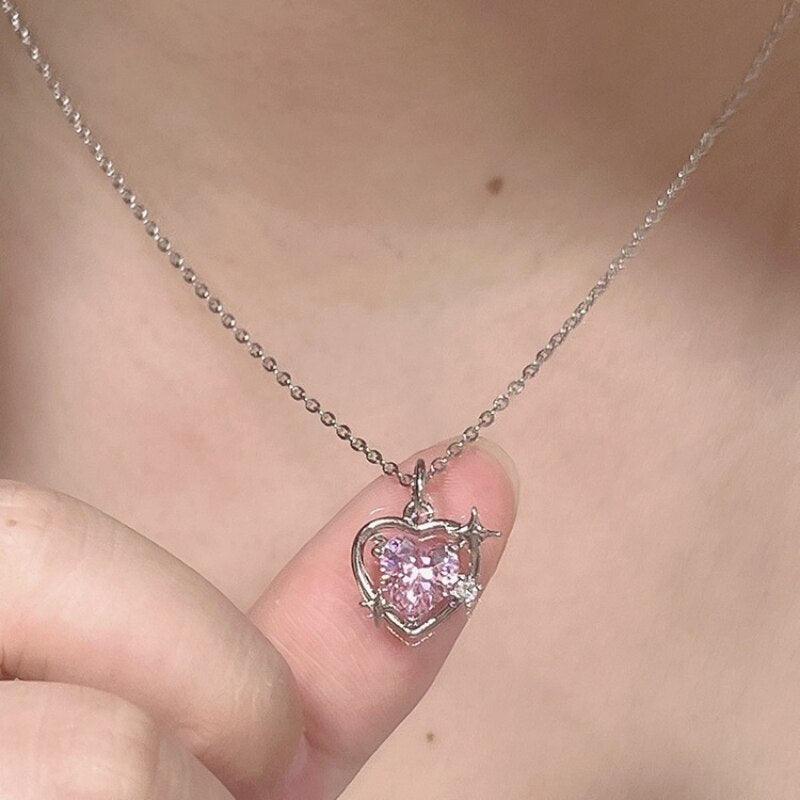 Heart crystal pendant necklace with silver-tone chain and pink faceted heart charm