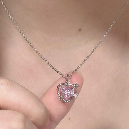 Heart crystal pendant necklace with silver-tone chain and pink faceted heart charm
