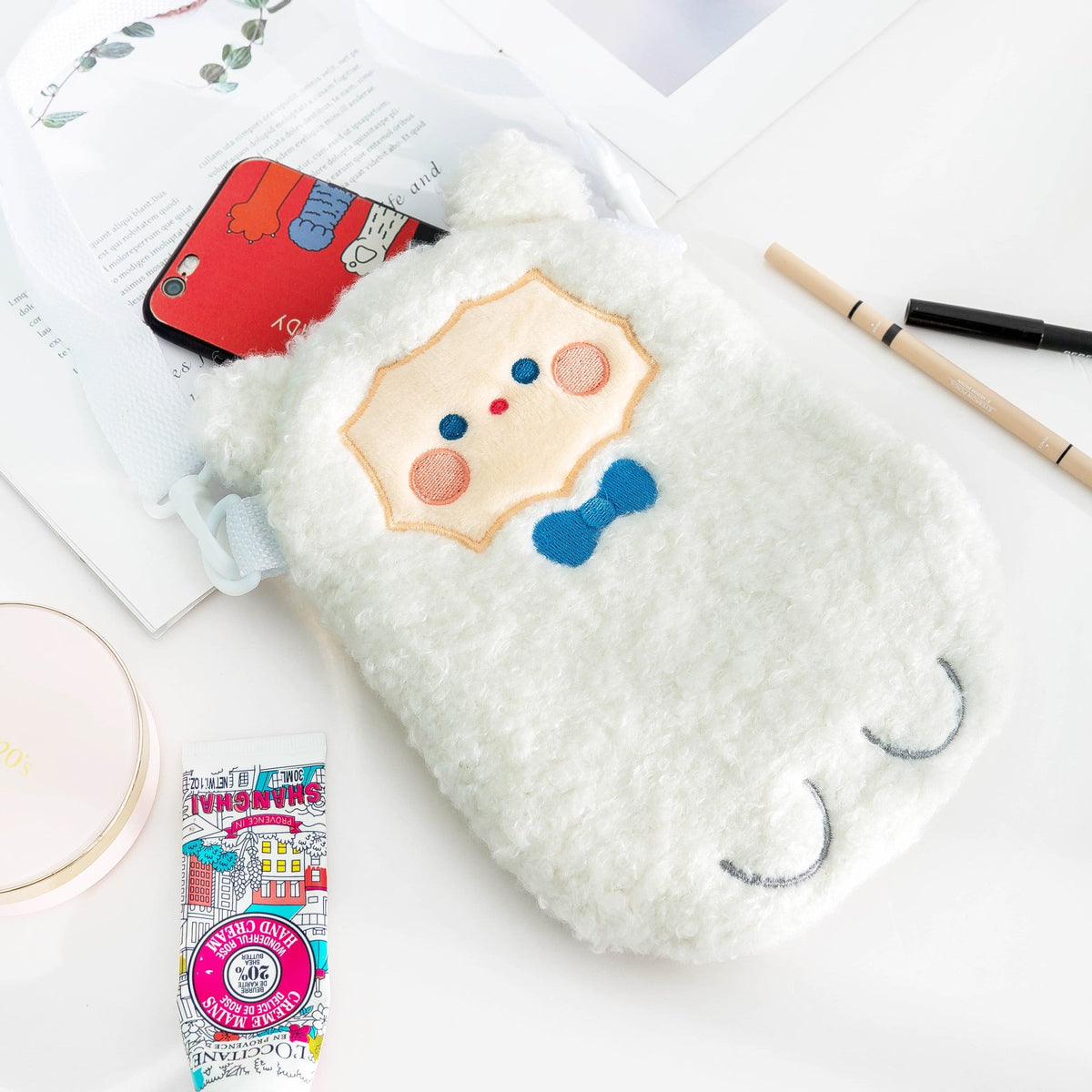 White plush animal crossbody bag with colorful face patch and adjustable strap