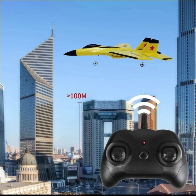 Yellow RC foam glider airplane with black 2.4G remote controller