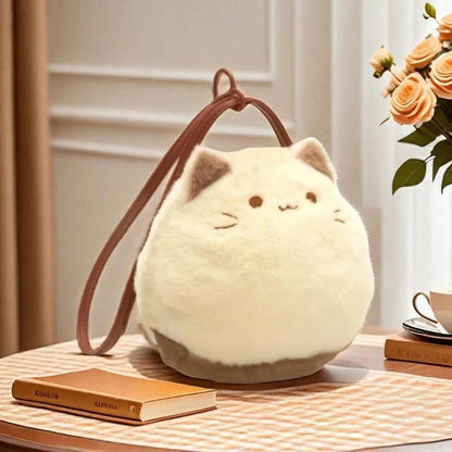 Cream cat plush mini handbag with brown handle and cute face applique on front.