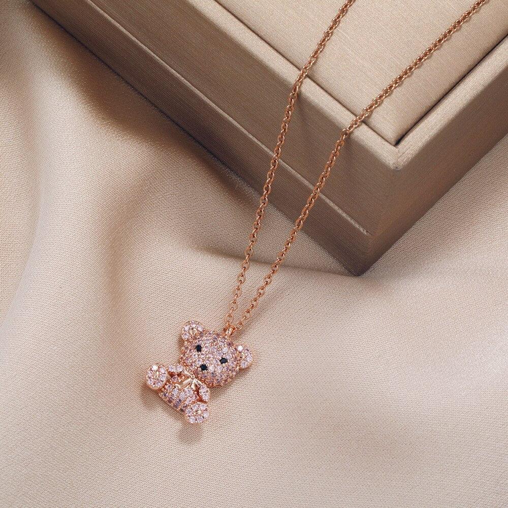 Teddy bear pendant necklace with pink-toned chain and glitter teddy bear pendant