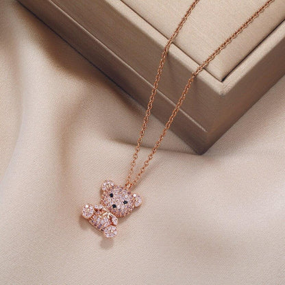Teddy bear pendant necklace with pink-toned chain and glitter teddy bear pendant