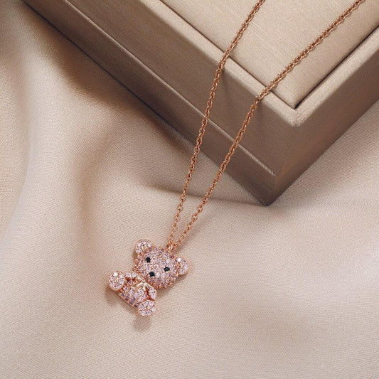 Teddy bear pendant necklace with pink-toned chain and glitter teddy bear pendant