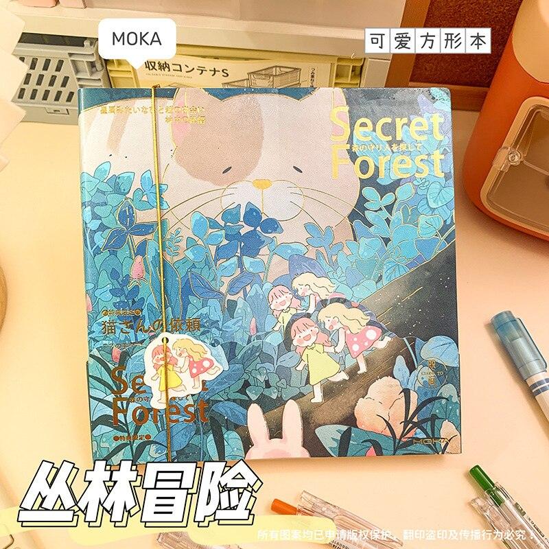 Blue illustrated notebook cover with bunny characters and plants in a forest setting