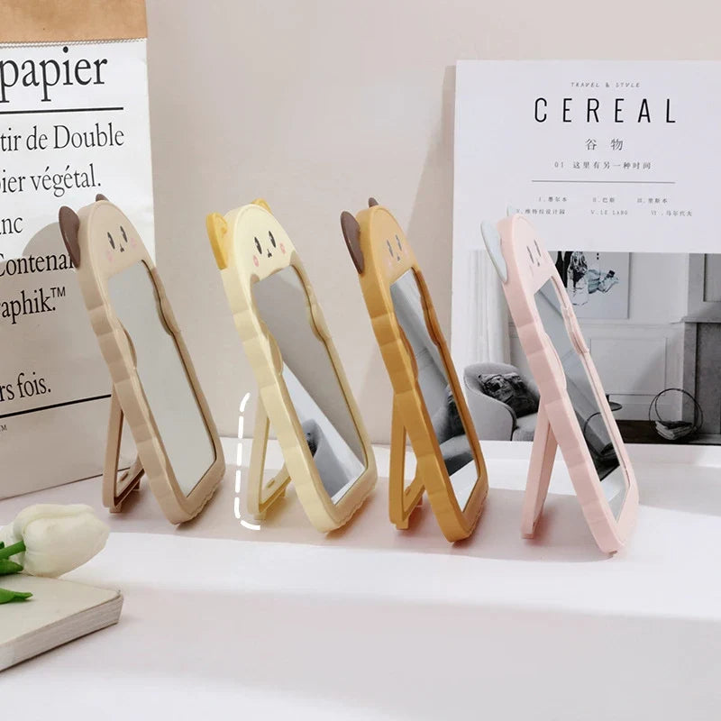 Assorted animal-shaped desktop mirrors in standing frames, showing multiple designs