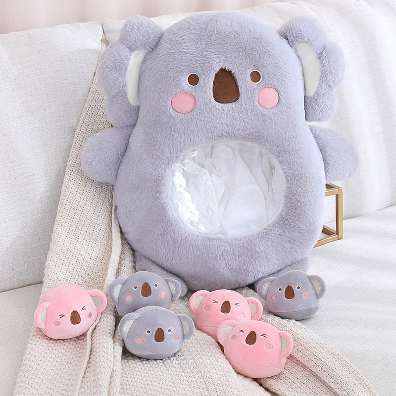 Plush animal shaped pillow in light grey with long ears and pink cheek details
