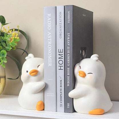 White duck book ends, set of two, holding books upright