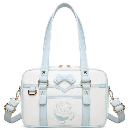 Light blue-and-white kawaii messenger bag with bow front, star accents, and side handles