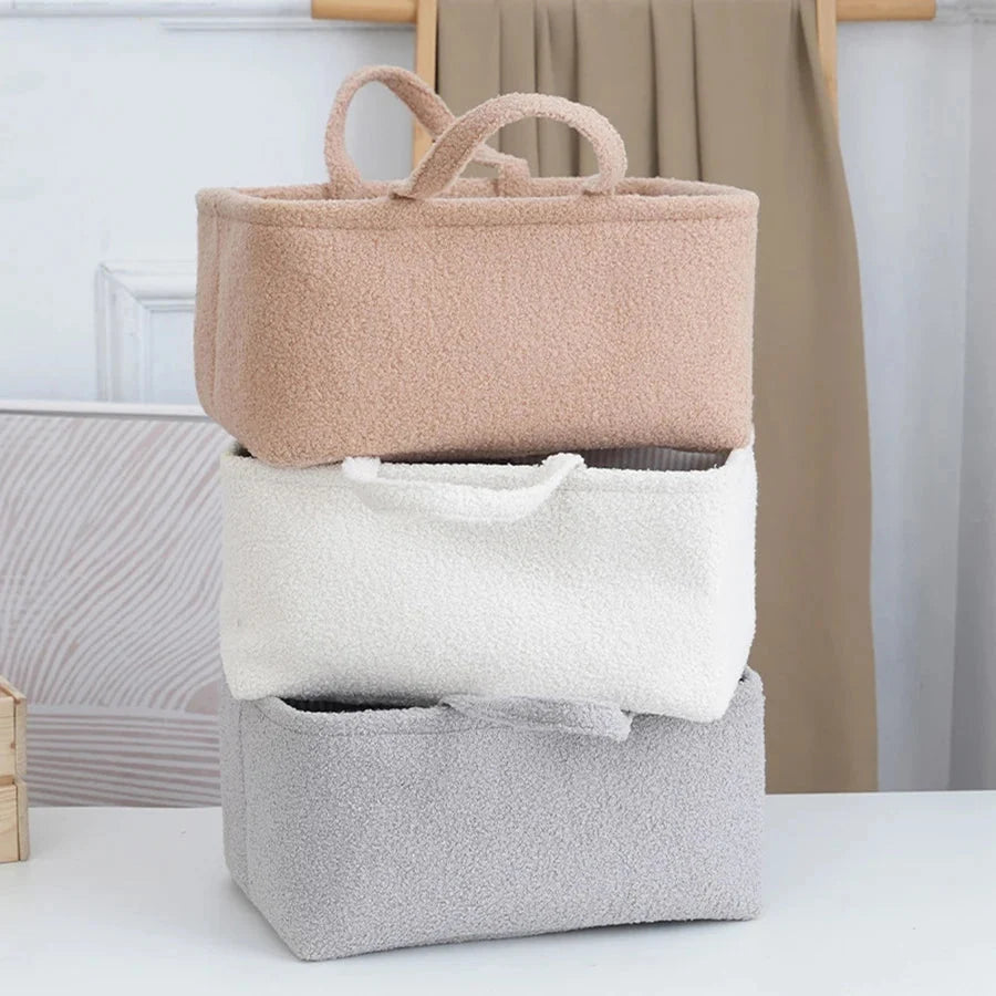 Stacked diaper caddy organizer bag in tan/beige fabric with two inner dividers