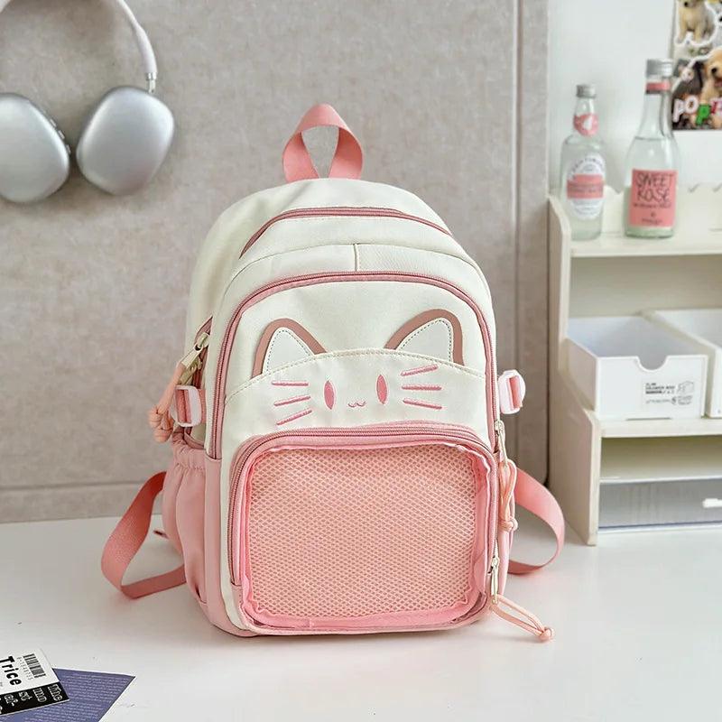 Pink and white cat-face school backpack with mesh front panel and adjustable straps