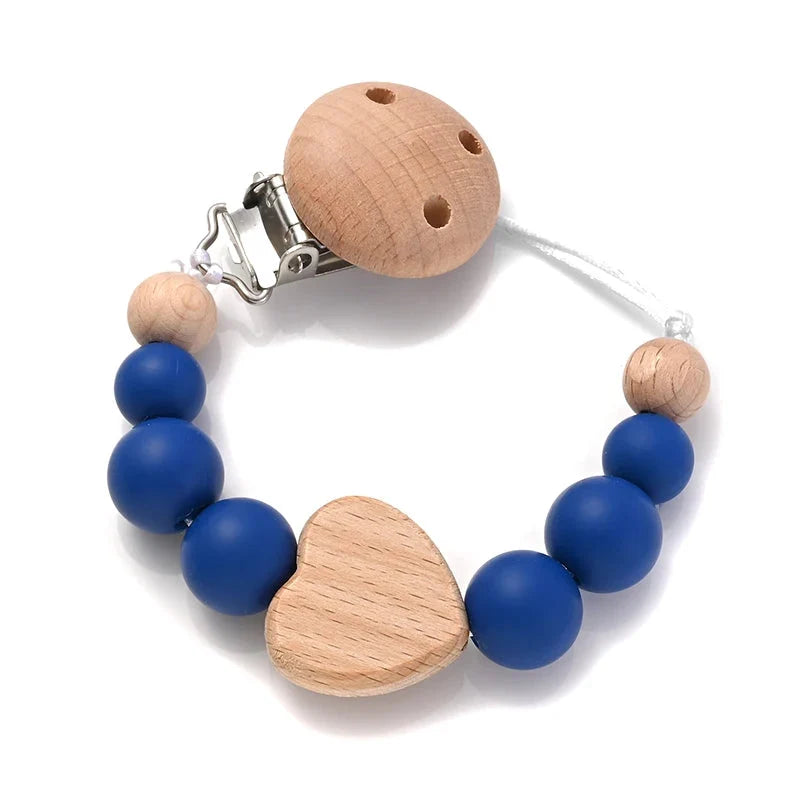 Baby pacifier clip with wooden heart bead and silicone blue beads, star-shaped teether