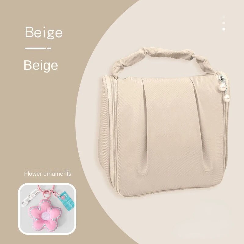 Beige hanging makeup bag with flower ornament pendant and beaded side charm