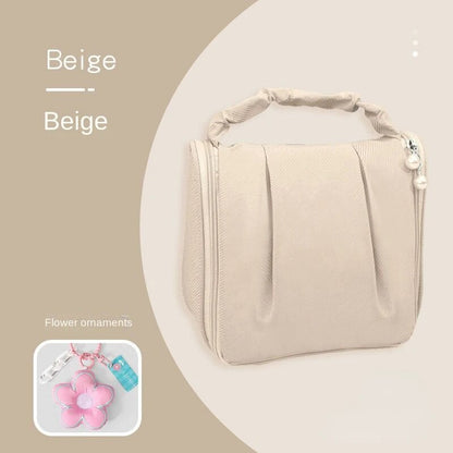 Beige hanging makeup bag with flower ornament pendant and beaded side charm