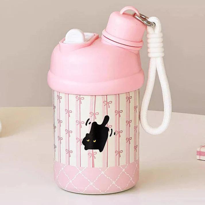 Pink thermos bottle with black cat cartoon, striped bow pattern and carry cord